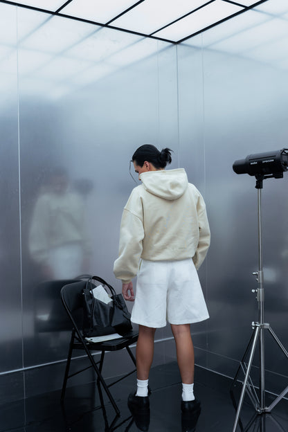 DOCUMENT COVER BUTTER HOODIE